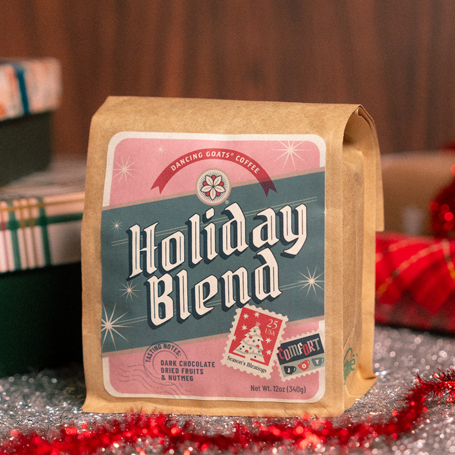 bag of holiday blend coffee with tinsel and presents