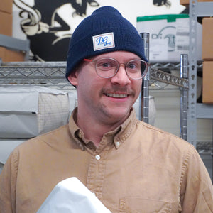 Team member wearing the logo beanie